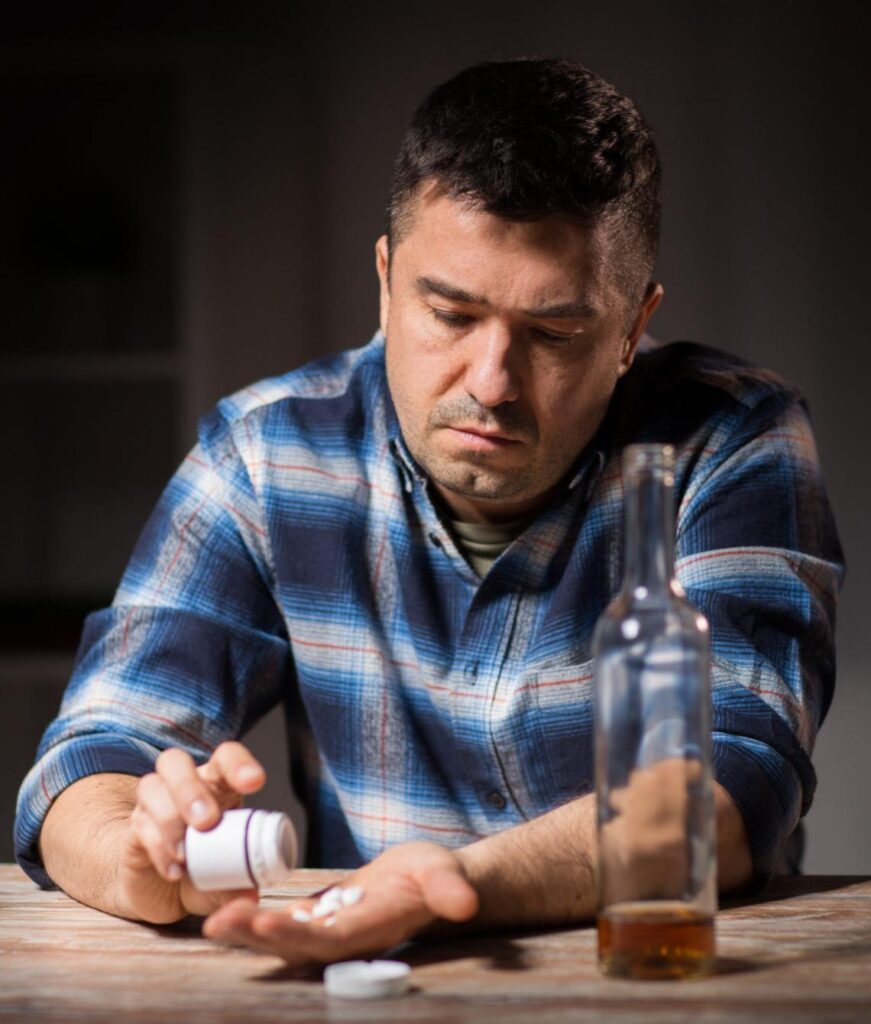 man taking a medicine