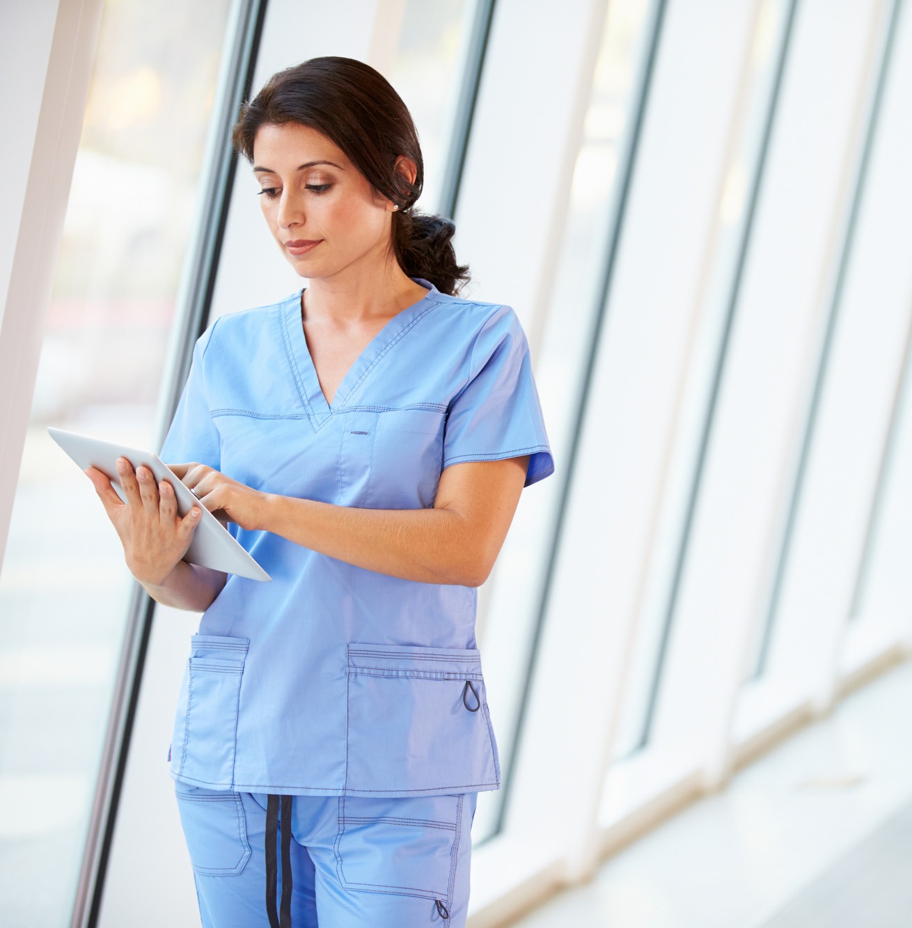 Nurse holding a tablet