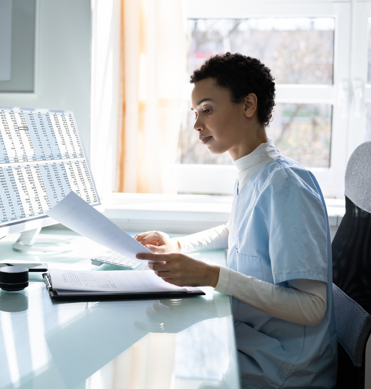 Nurse reviewing the documents